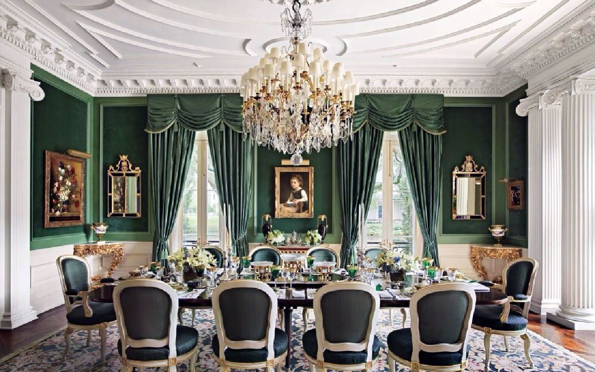 A stately dining room with ornate crown moulding