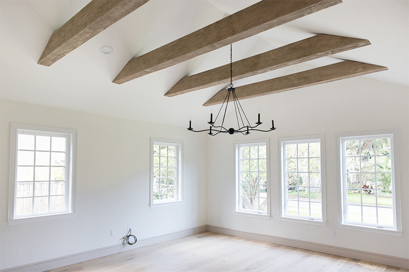 Faux beams installed on a vaulted ceiling