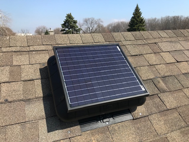 Flat Base Solar Fan installed on a shingled roof.